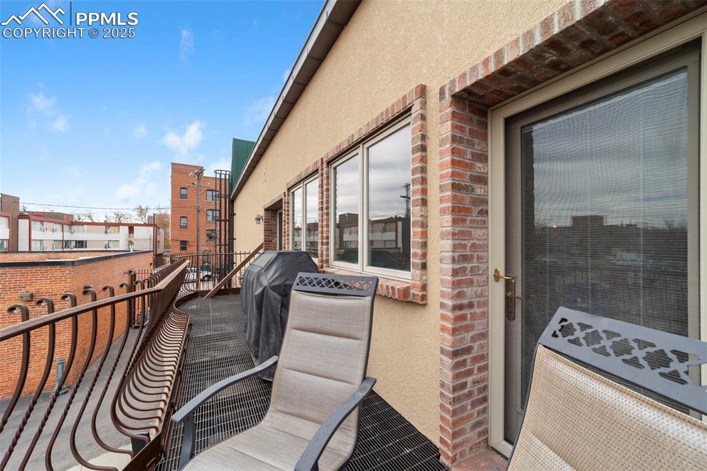 Image 33 of 40: Terrace featuring area for grilling and gas line so you are not lugging in 