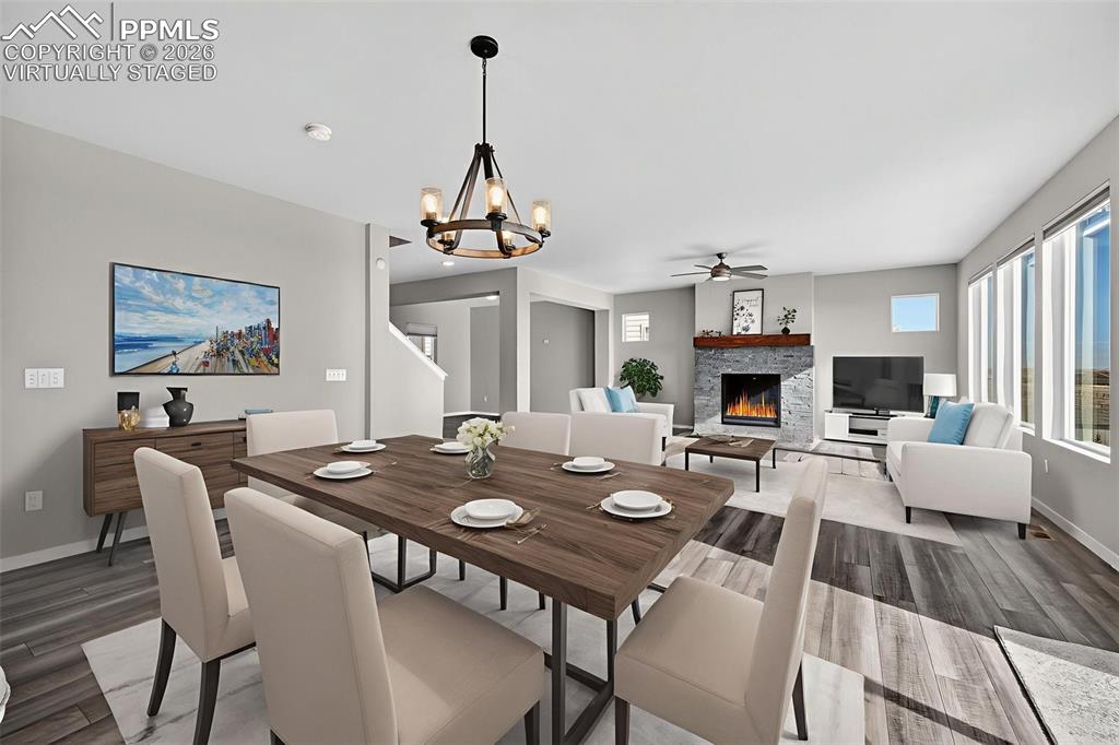 Image 9 of 46: Virtually staged Dining area and Living Room