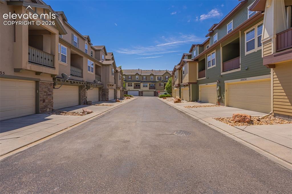 Image 22 of 26: Townhome community featuring multi-level units with attached garages