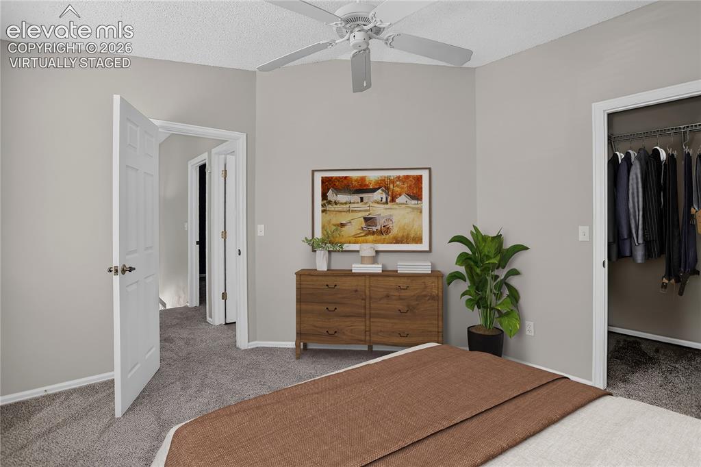 Image 25 of 44: Primary Bedroom - Virtually Staged with King Bed