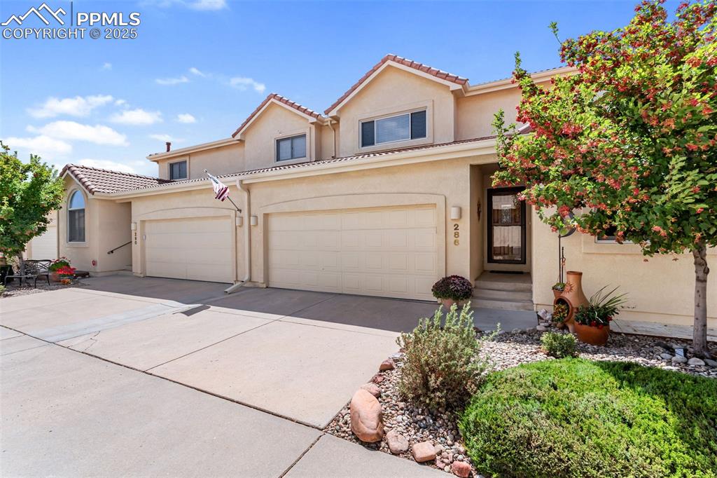 Image 2 of 50: Mediterranean / spanish-style home with stucco siding, driveway, an attache