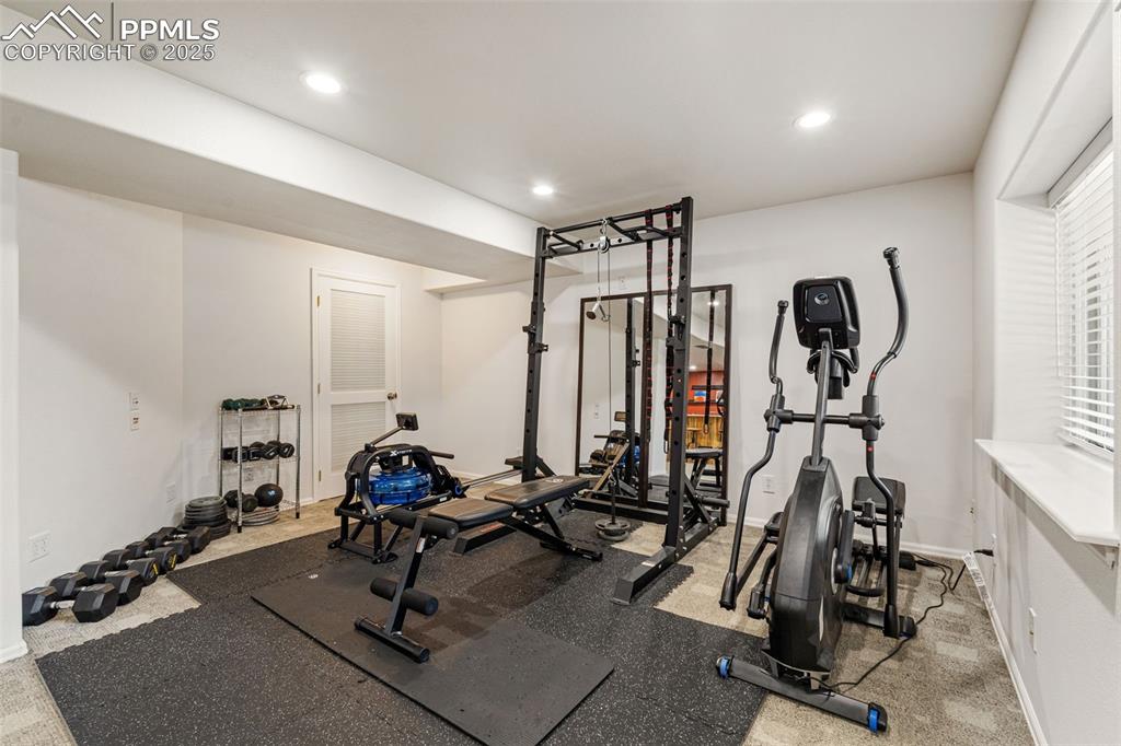 Image 35 of 50: Workout area with recessed lighting and baseboards