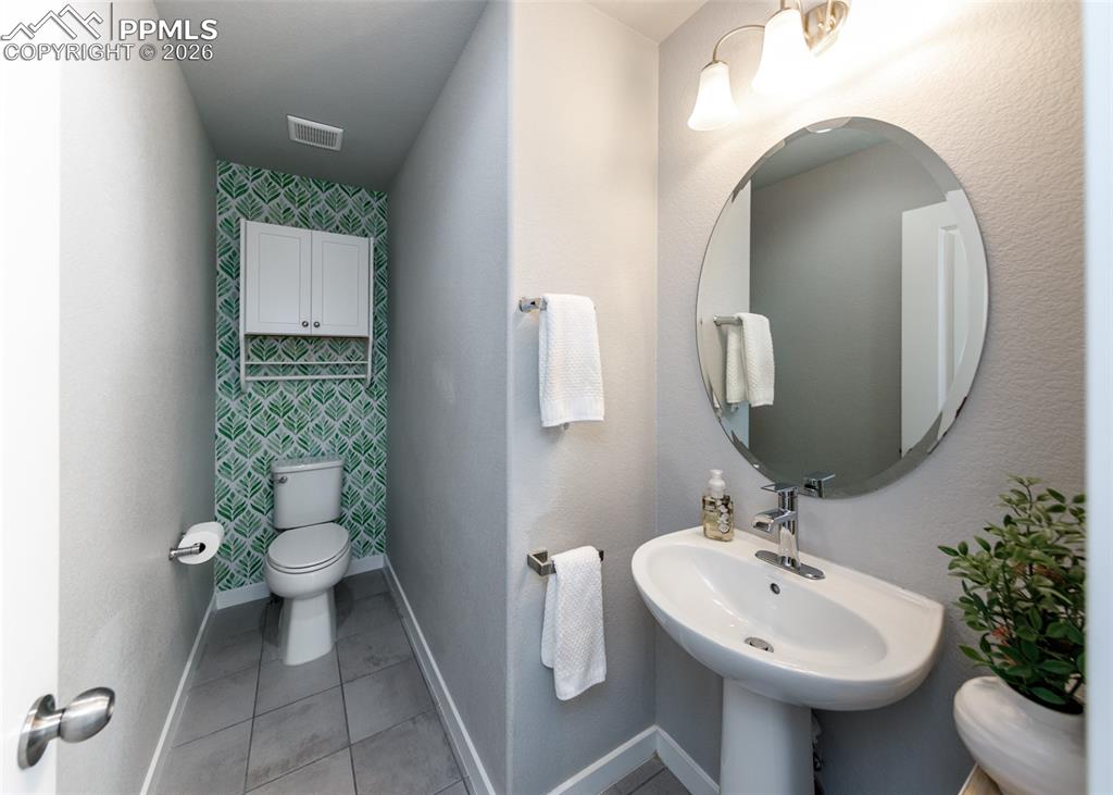 Image 15 of 50: Half Bath on Main Floor