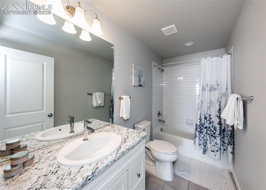 Image 29 of 50: Upstairs Hall Bath