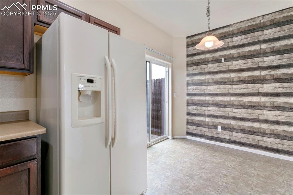 Image 10 of 26: Kitchen w/ designated eat-in area