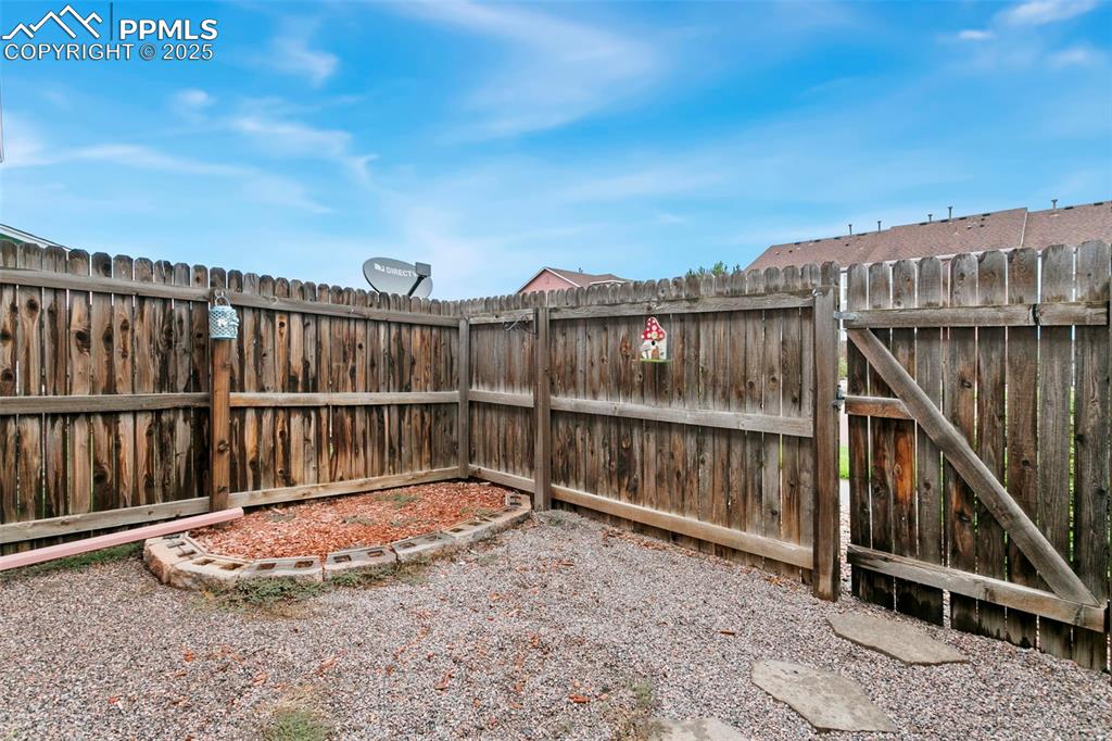 Image 25 of 26: Fenced backyard