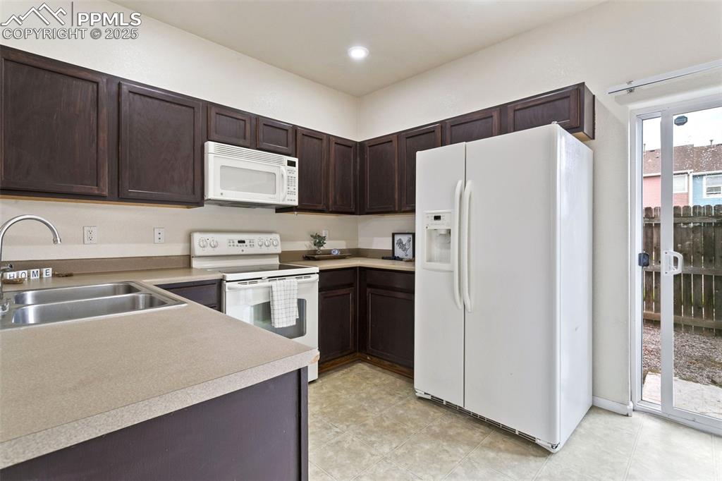 Image 8 of 26: Walking in the kitchen with walk out on right side