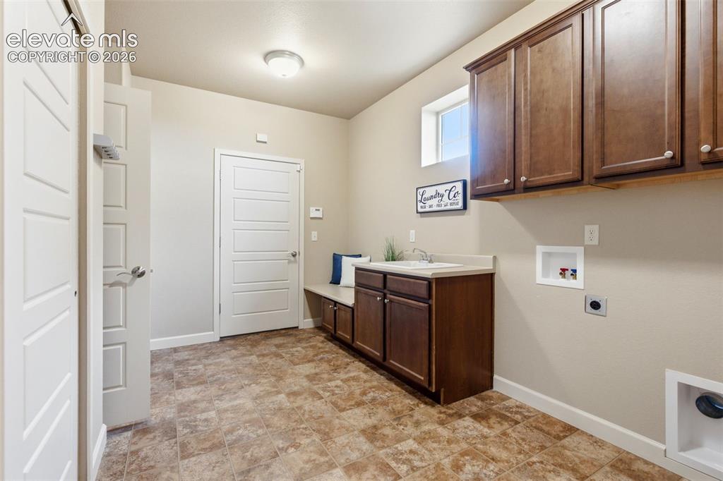 Image 31 of 50: Laundry Room/Mudroom connecting to Garage