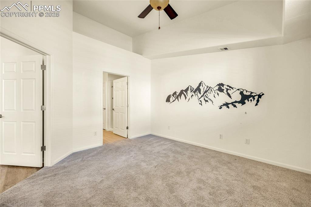 Image 19 of 37: Spare room featuring light carpet and ceiling fan
