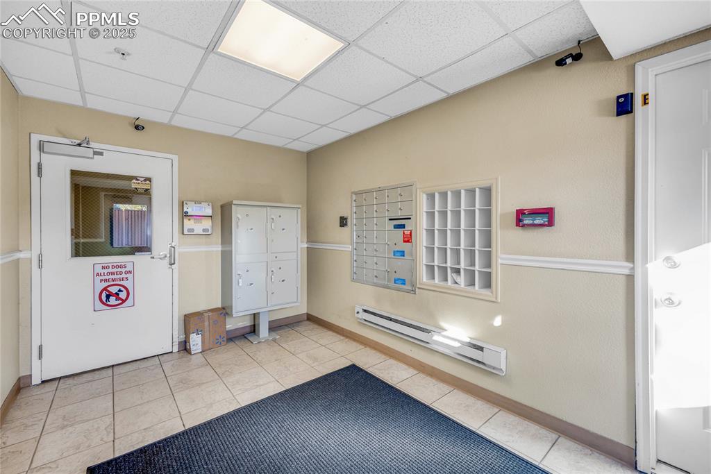 Image 36 of 37: Community lobby with a paneled ceiling