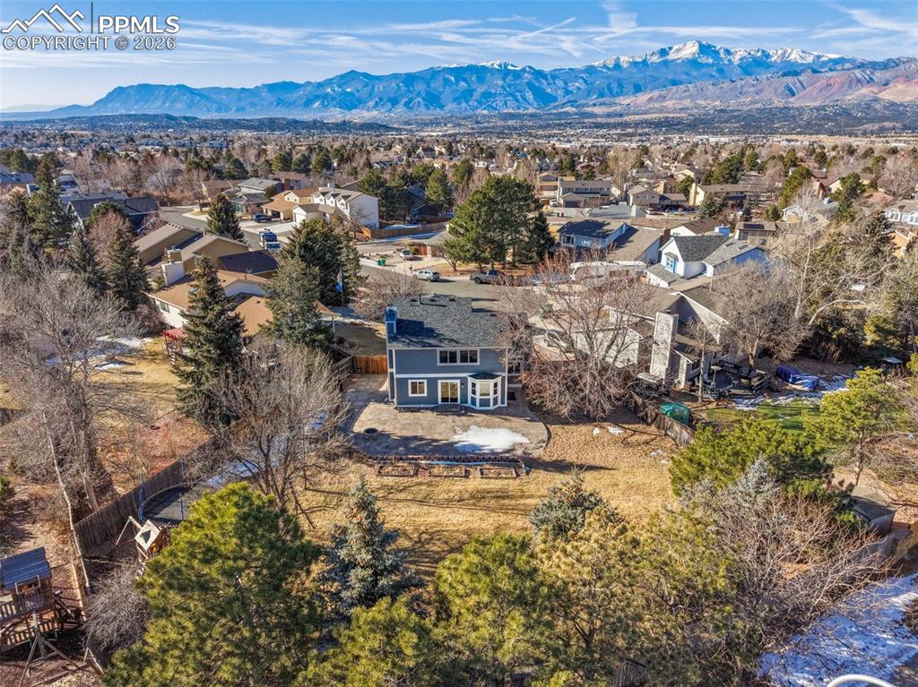 Image 2 of 36: Aerial view of residential area featuring mountains