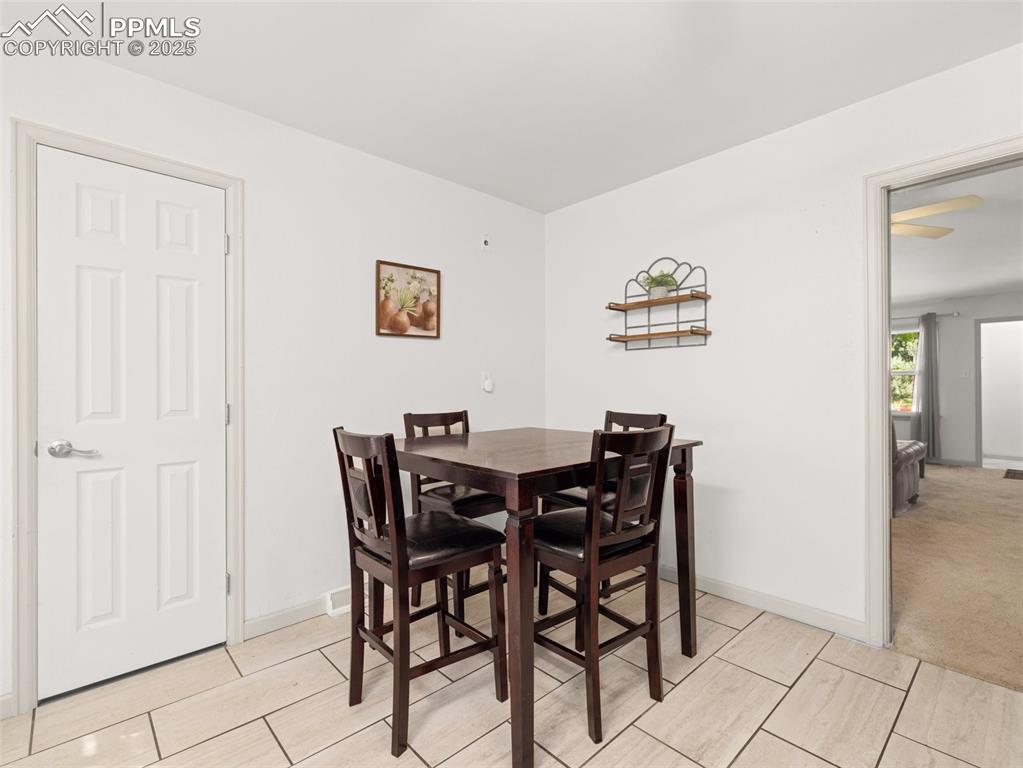 Image 14 of 18: Dining area featuring baseboards