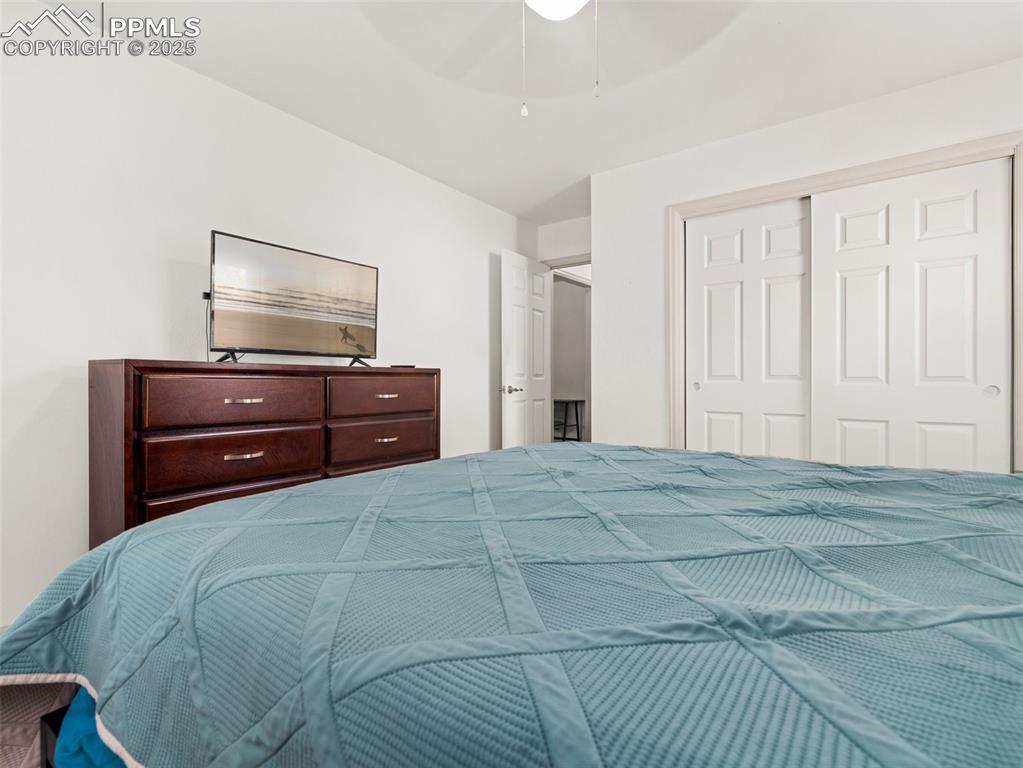 Image 5 of 18: Bedroom featuring a closet and ceiling fan