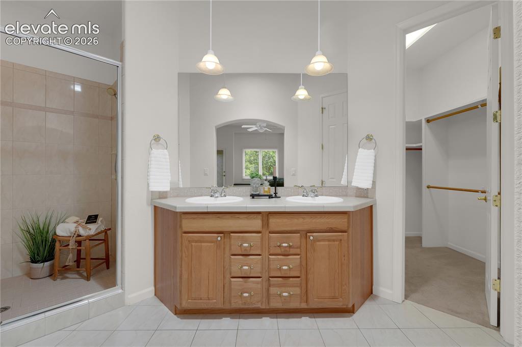 Image 15 of 35: Primary en-suite bathroom with large walk-in closet