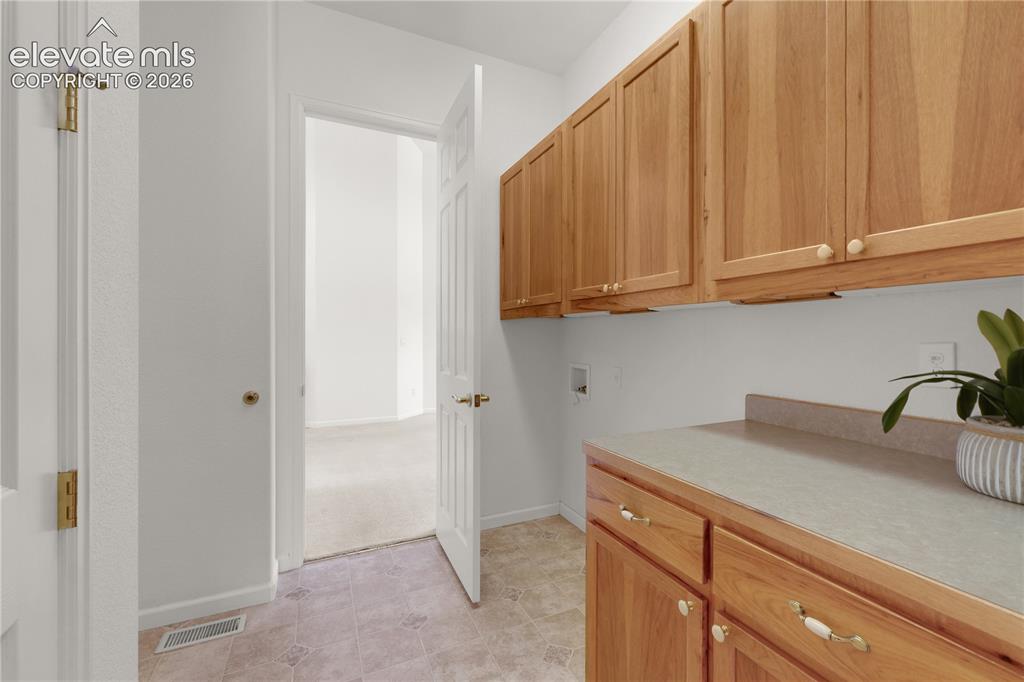 Image 18 of 35: Convenient laundry on main level