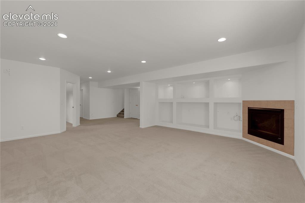 Image 21 of 35: Cozy gas fireplace