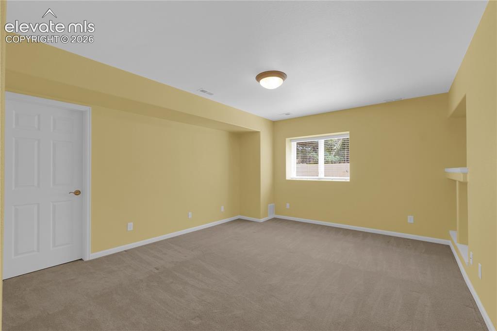 Image 22 of 35: Basement bedroom
