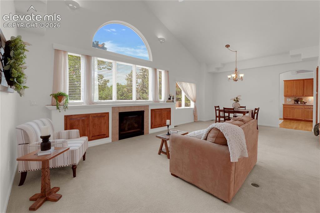Image 8 of 35: Great room with wall of windows