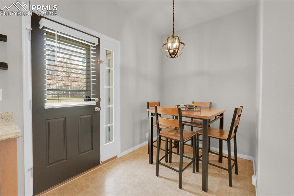 Image 4 of 15: Dining room with chandelier