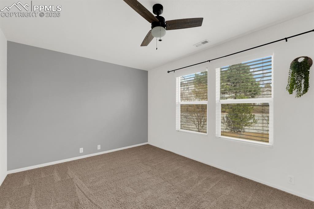 Image 7 of 15: Bedroom featuring carpet flooring and ceiling fan