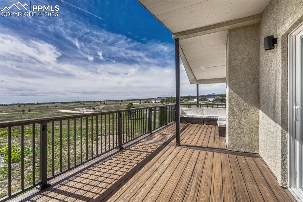 Image 12 of 50: Additional deck off of kitchen with amazing views