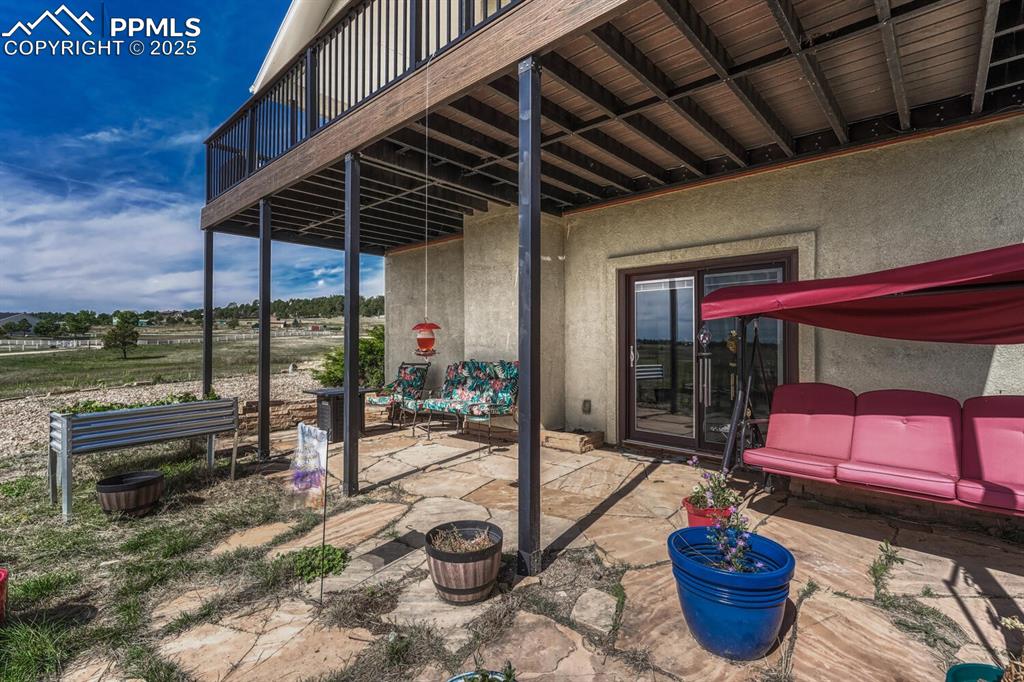 Image 18 of 50: Walk out patio from lower level
