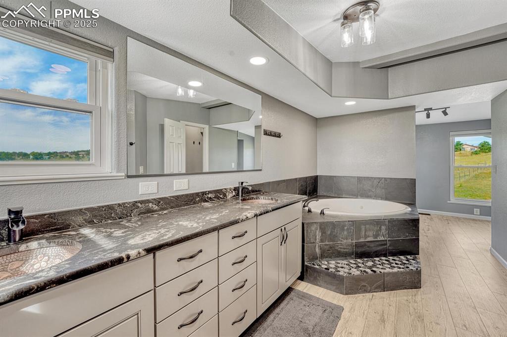 Image 26 of 50: Primary bathroom with double sinks, 5 piece bathroom suite