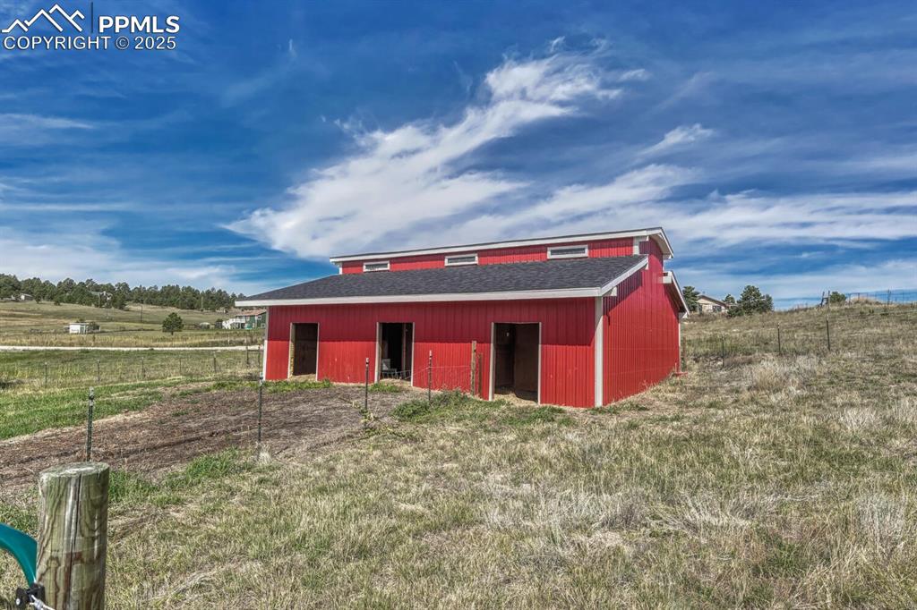Image 7 of 50: View of barn with a rural view
