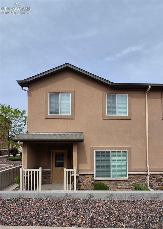 Image 1 of 23: Front entry with enclosed patio