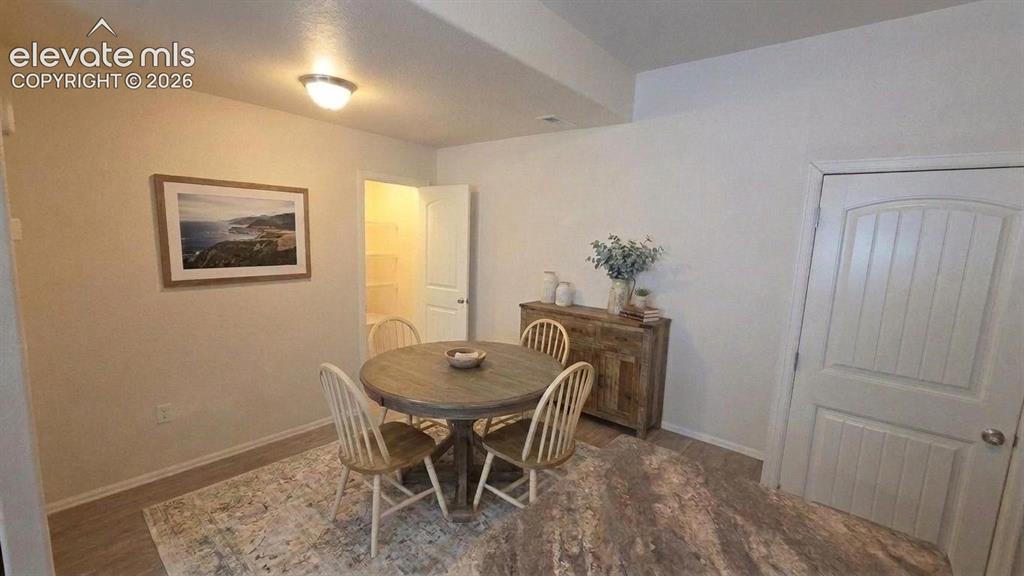 Image 4 of 23: Dining area and access to pantry