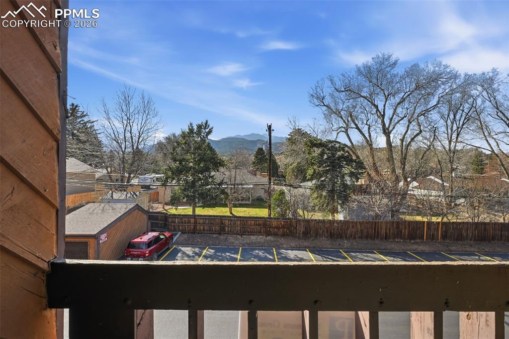 Image 20 of 28: Upper level bedroom Balcony with west facing mountain views