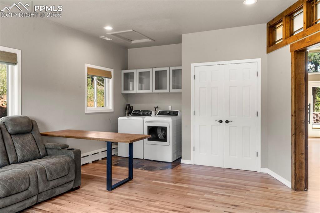 Image 15 of 46: Office area with light wood-style floors, recessed lighting, a baseboard he