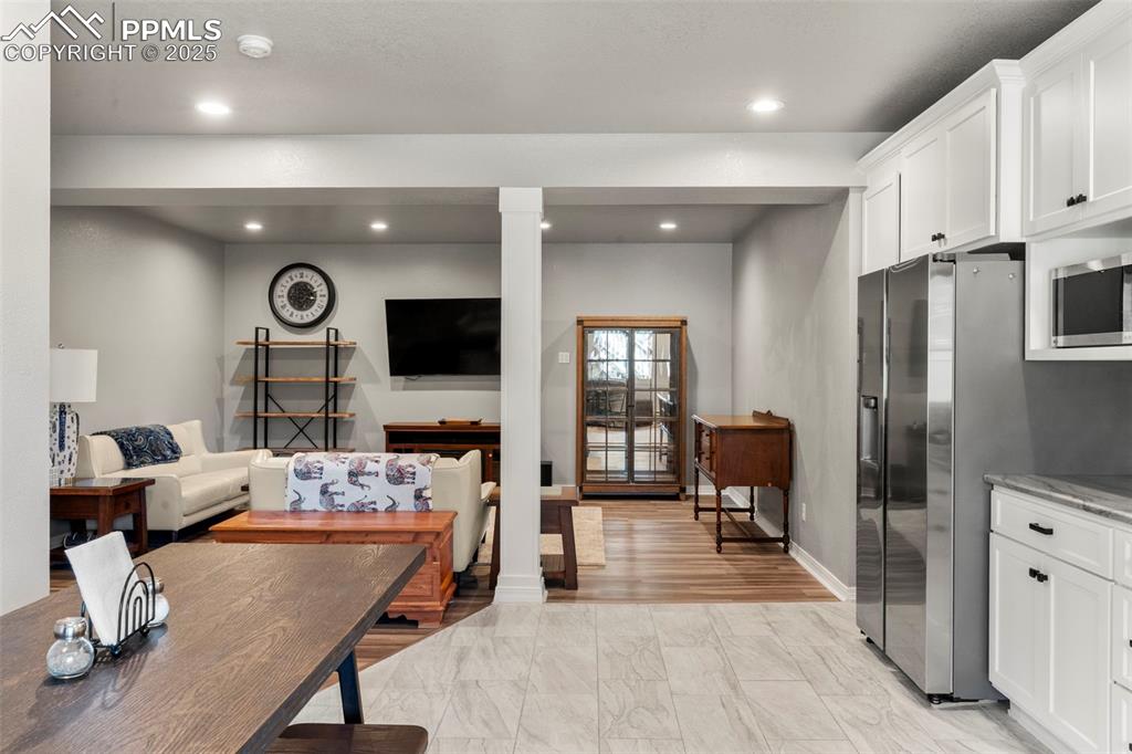 Image 27 of 46: Living room featuring recessed lighting and baseboards