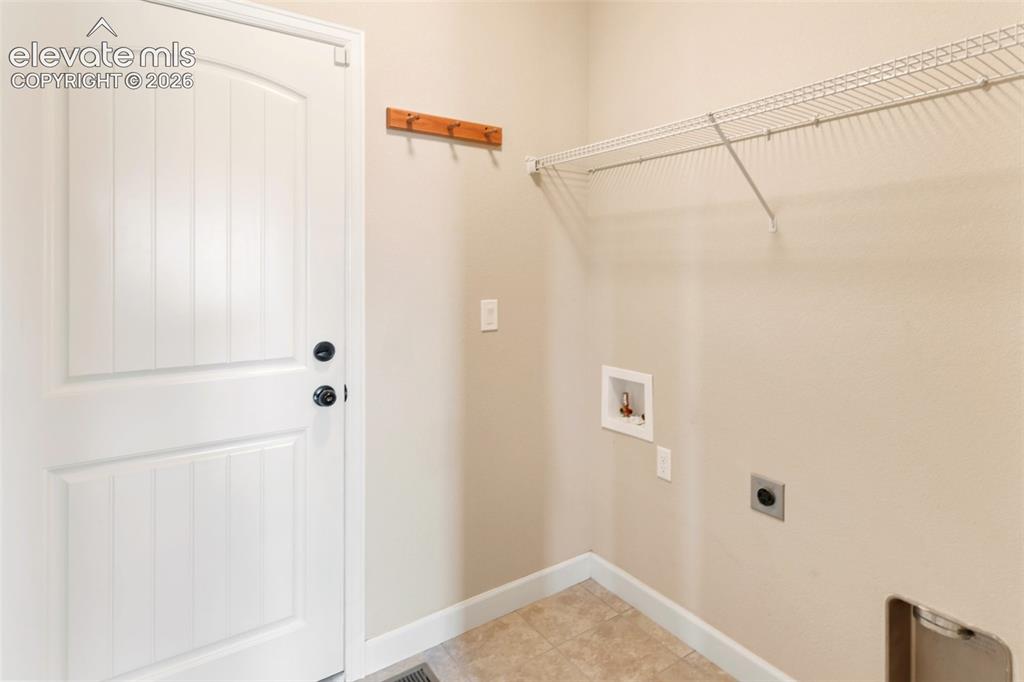 Image 15 of 35: Soaking tub to relax with top down or bottom up blinds and skylight above