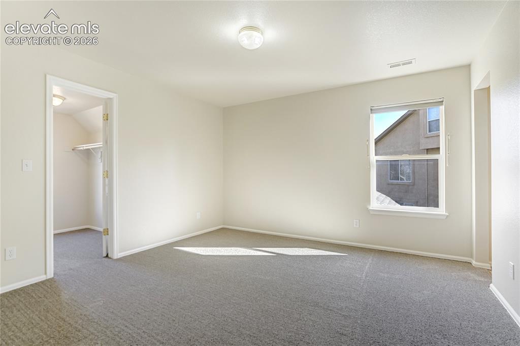 Image 36 of 48: Upper bedroom with Jack and Jill bath