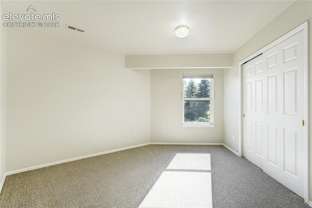 Image 38 of 48: Upper bedroom with Jack and Jill bath