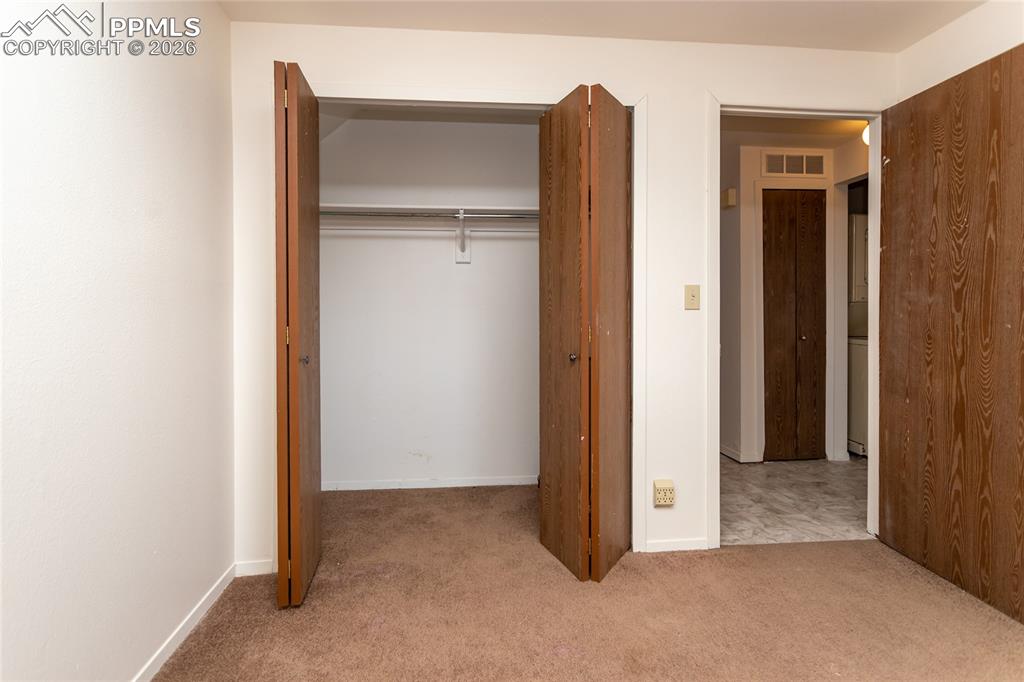 Image 13 of 39: Second bedroom closet. Unoccupied unit 1903