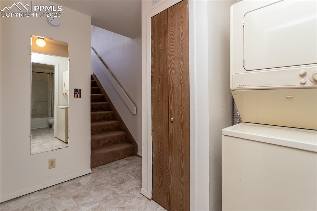 Image 15 of 39: Laundry is on the lower level. Unoccupied unit 1903