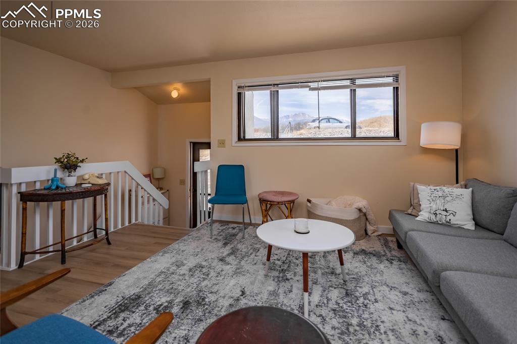 Image 19 of 39: Updated living room has beautiful mountain views. Occupied unit 1905