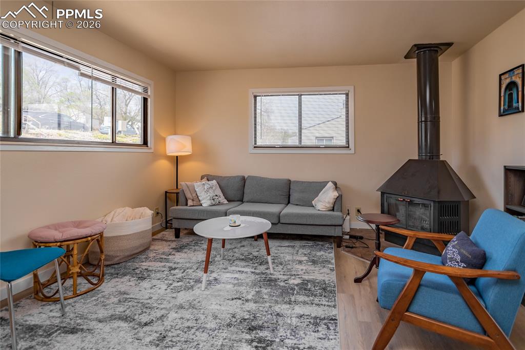 Image 20 of 39: Wood burning stove also in the occupied unit 1905.