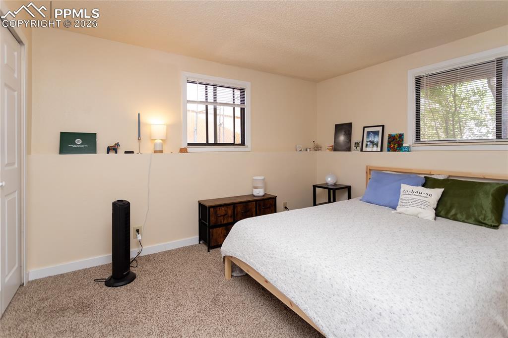 Image 24 of 39: Main bedroom is on the lower level. Occupied unit 1905