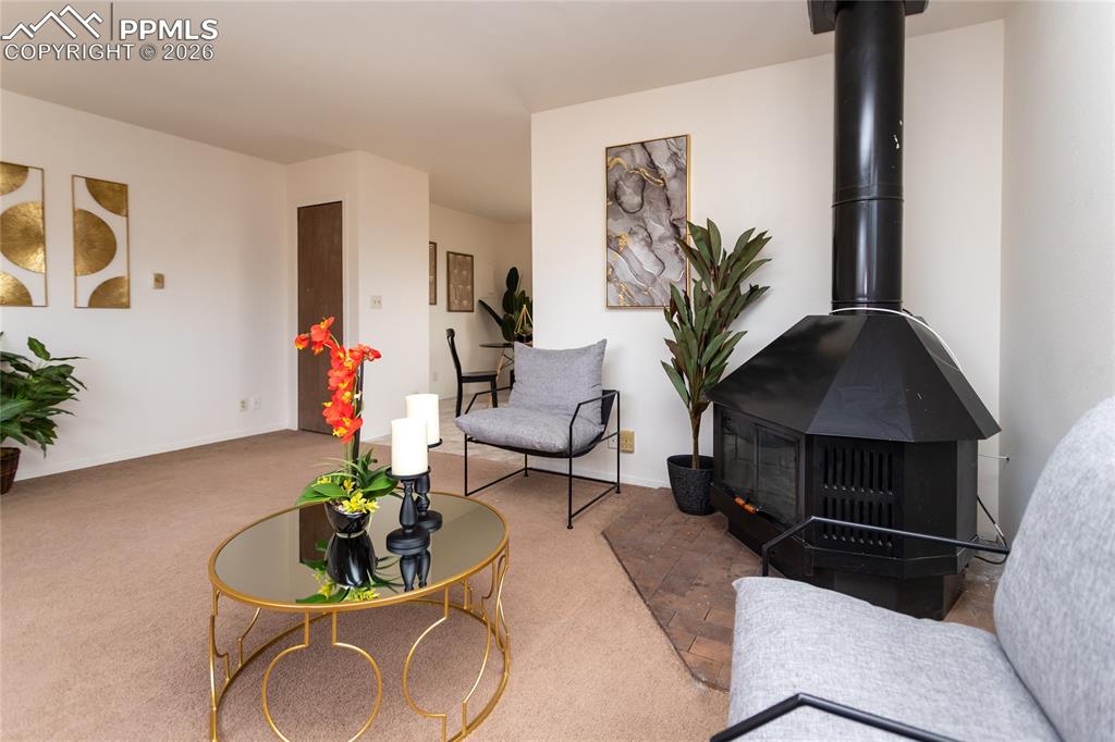 Image 5 of 39: Enjoy both radiant heat and a woodburning stove. Unoccupied unit 1903