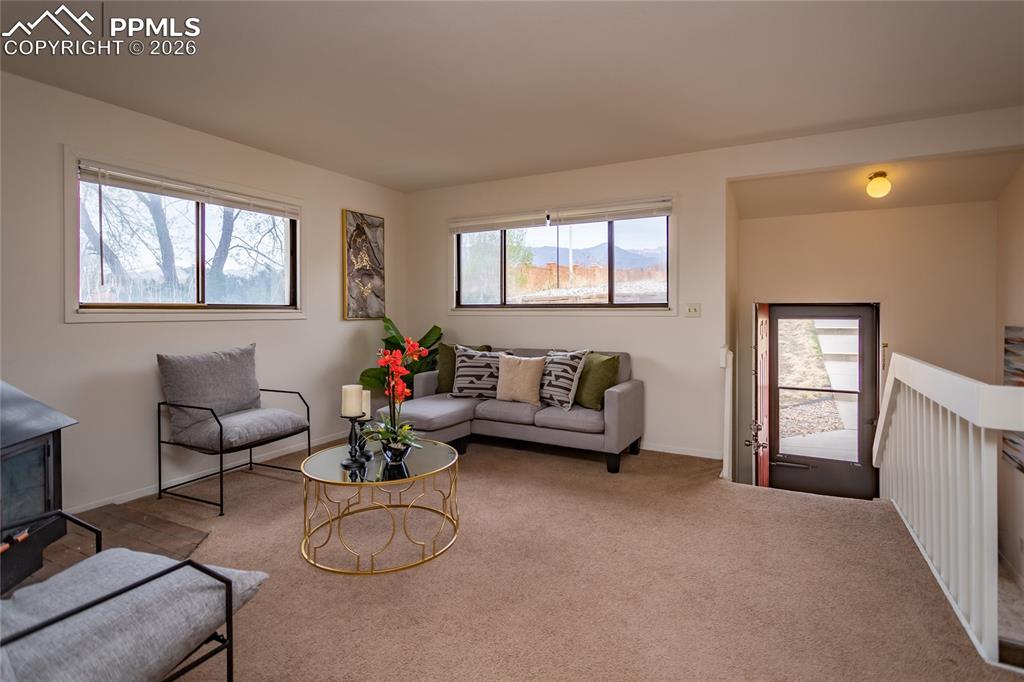 Image 9 of 39: Living room is on the west side with beautiful mountain views. Unoccupied u