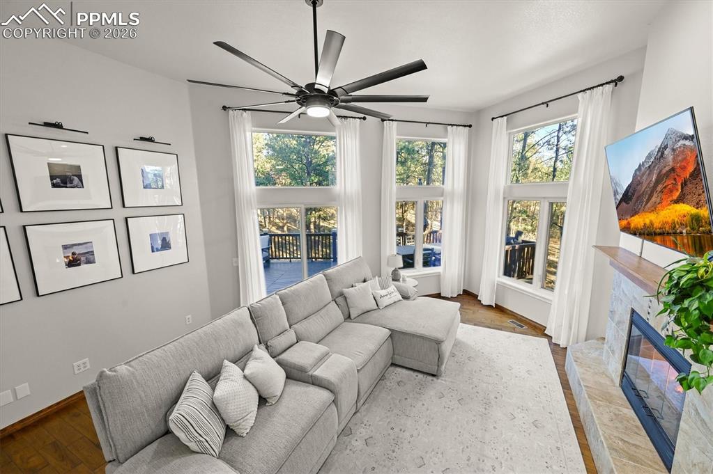 Image 10 of 47: Sunken living room with walkout access to private deck