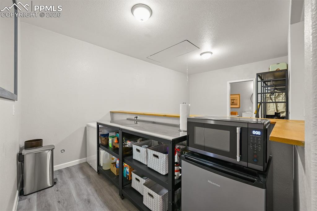 Image 32 of 47: Kitchenette area in basement