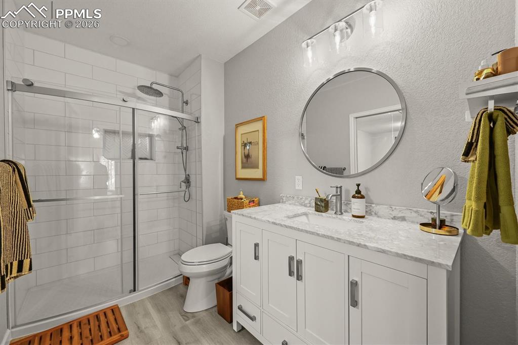 Image 37 of 47: Basement bathroom attached to bedroom