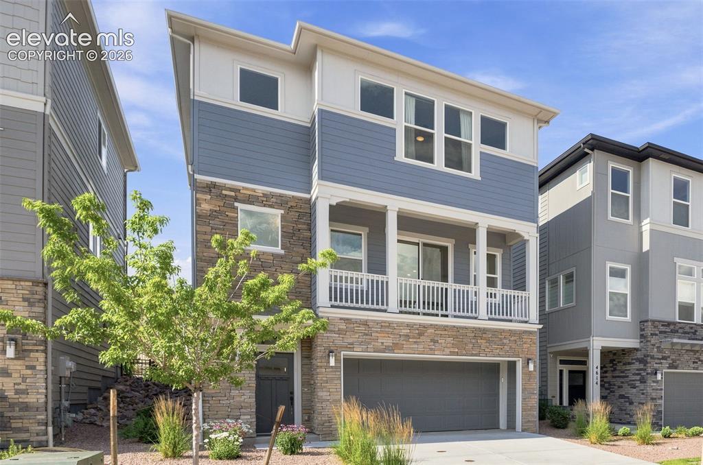 Caption: Front of the home has bump out in front of the garage to store trash bins