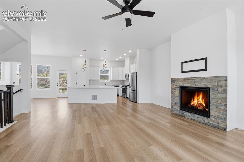 Image 10 of 31: View of living room and kitchen