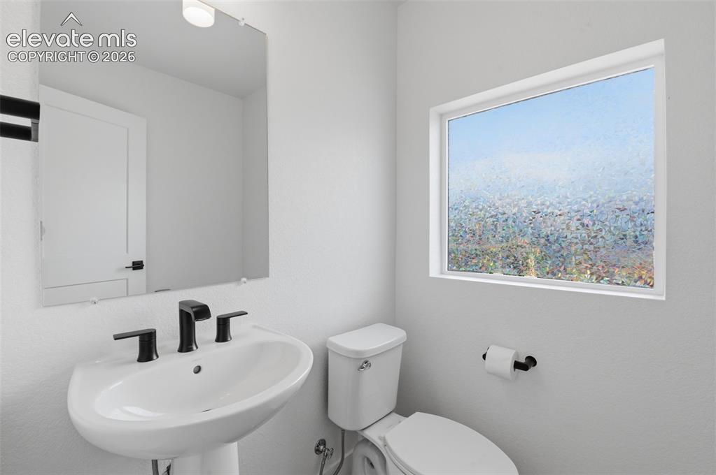 Image 14 of 31: 2nd Story powder bathroom