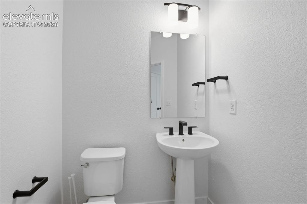 Image 23 of 31: Basement powder bathroom